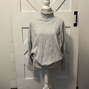 GAP Women’s XL turtleneck sweater. Soft light grey.  You won’t be disappointed.